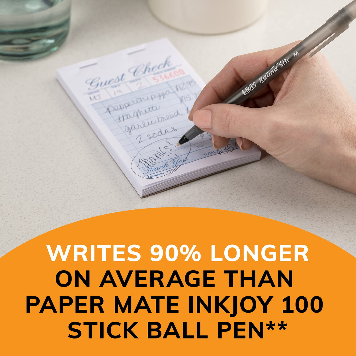 Hand writing with a black ballpoint pen on lined notebook page.