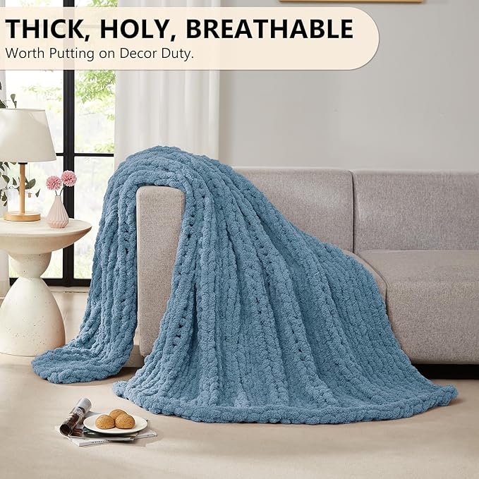 Airy blue thick chunky chenille knit throw blanket draped over sofa arm