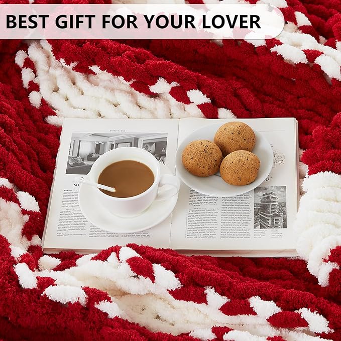 Red and white striped chunky knit throw blanket with close-up fabric texture