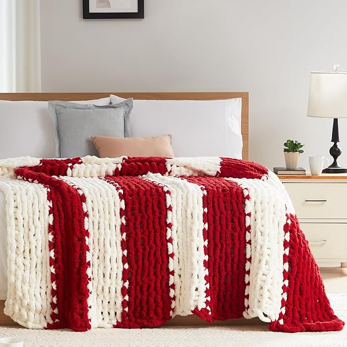 Chunky cable knit throw blanket with red and white vertical stripe pattern