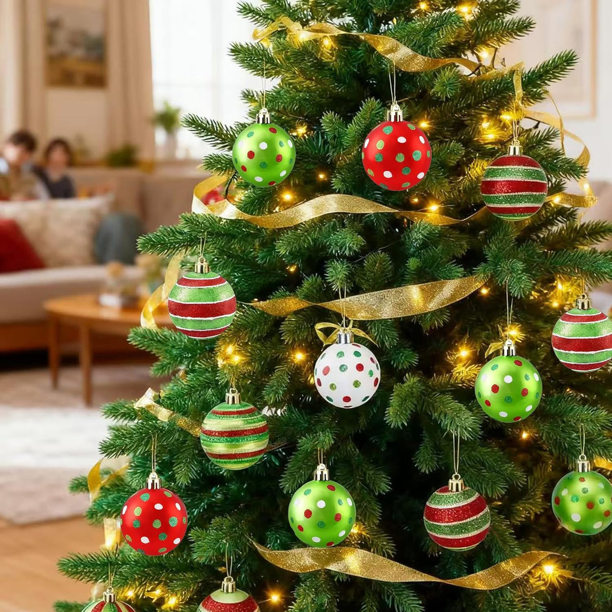Shatterproof Christmas ball ornaments with striped and polka-dot patterns hanging on a tree