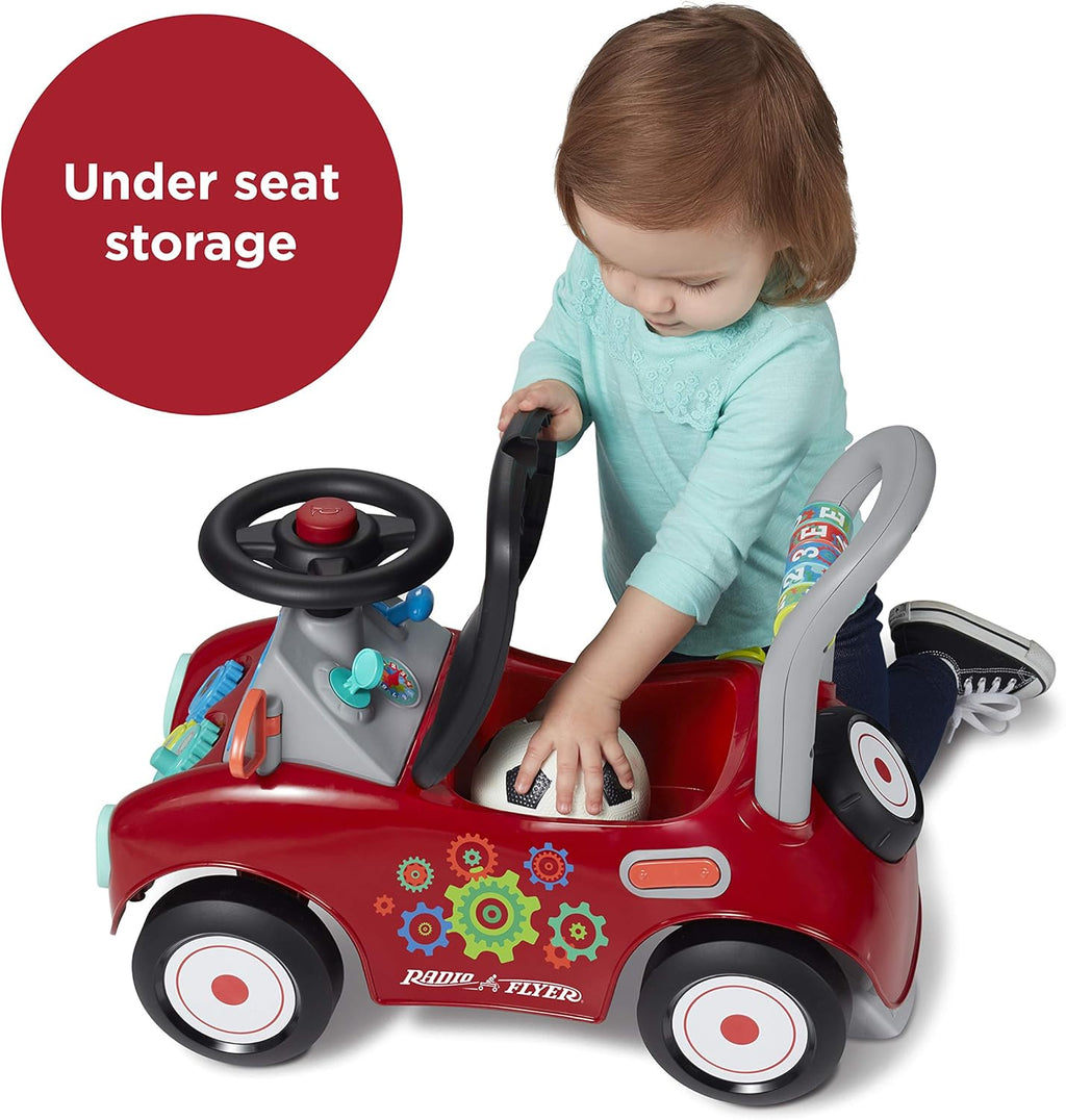 Red ride-on car with under-seat storage, seat and steering wheel for toddlers