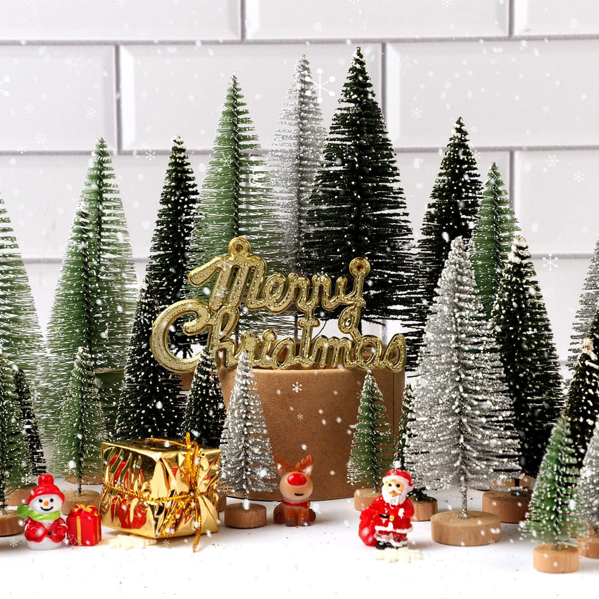 Mini Christmas tree display with gold 'Merry Christmas' topper and bottle-brush trees