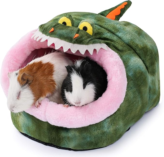 Green plush animal hideout tent with pink interior and cartoon shark-mouthed hood