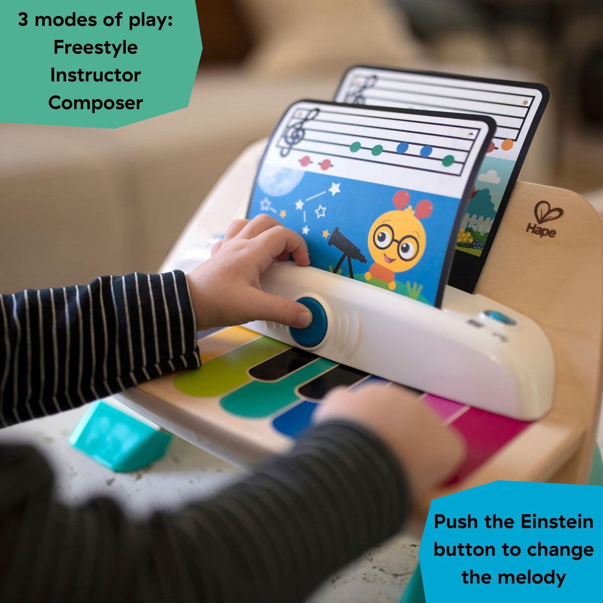 Wooden children’s piano toy showing colorful keys and music screen with button