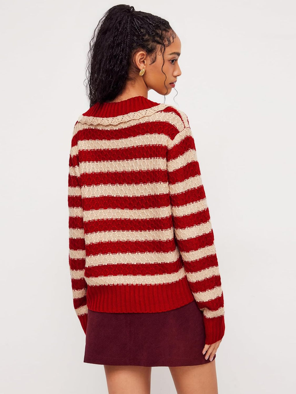 Back view of red and cream striped knit sweater with ribbed hem and cuffs