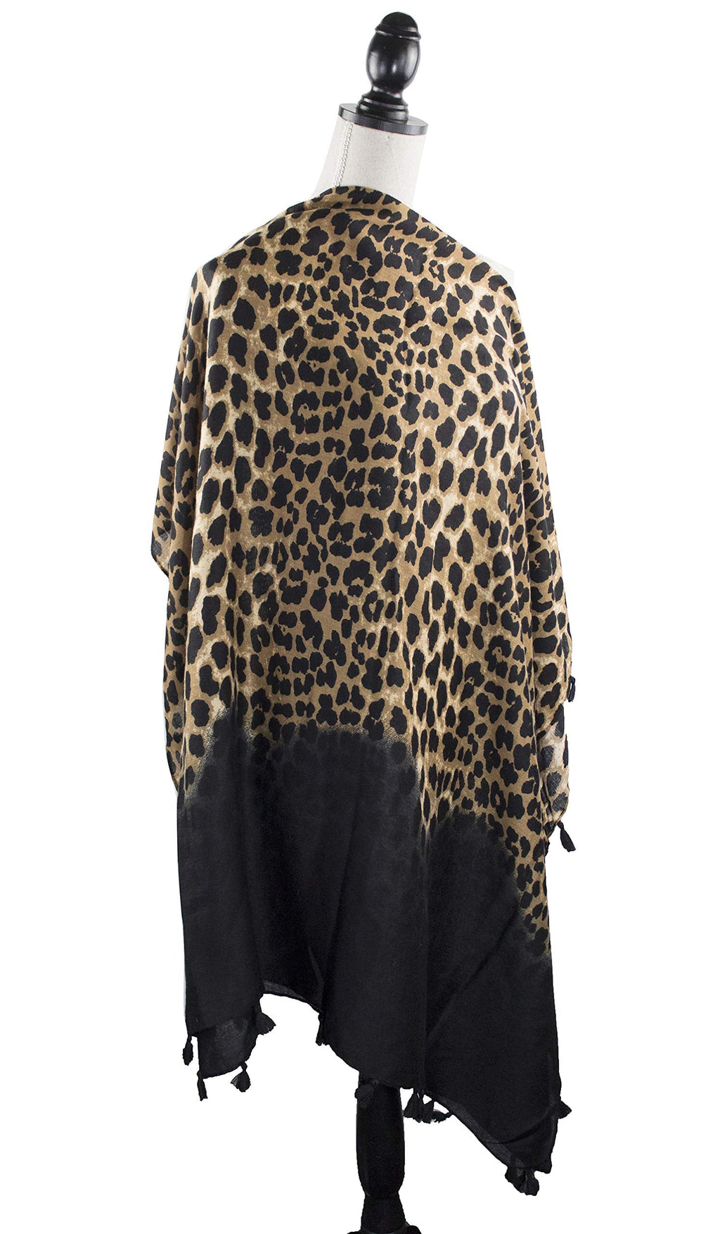 Leopard print scarf wrap with tassel trim, black bottom panel detail.