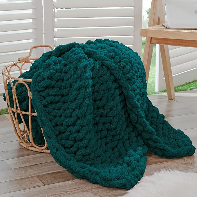 Dark green chunky knit throw blanket with rope-knot cable texture and rounded edges