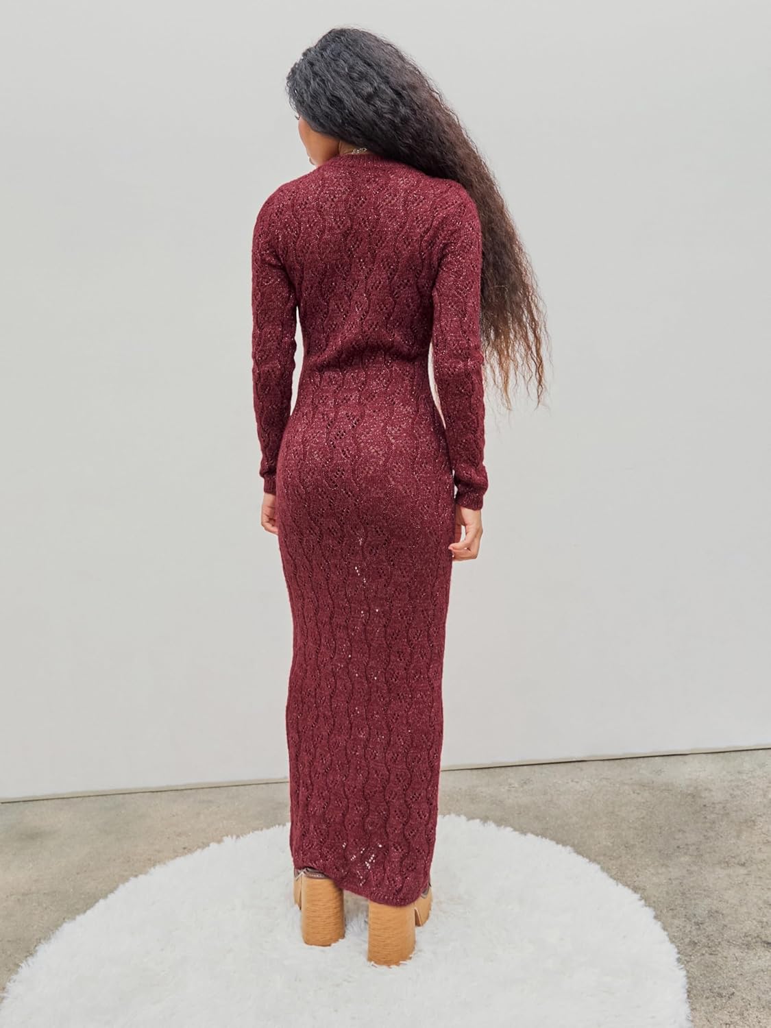 Burgundy long-sleeve crewneck maxi sweater dress with textured knit, back view.