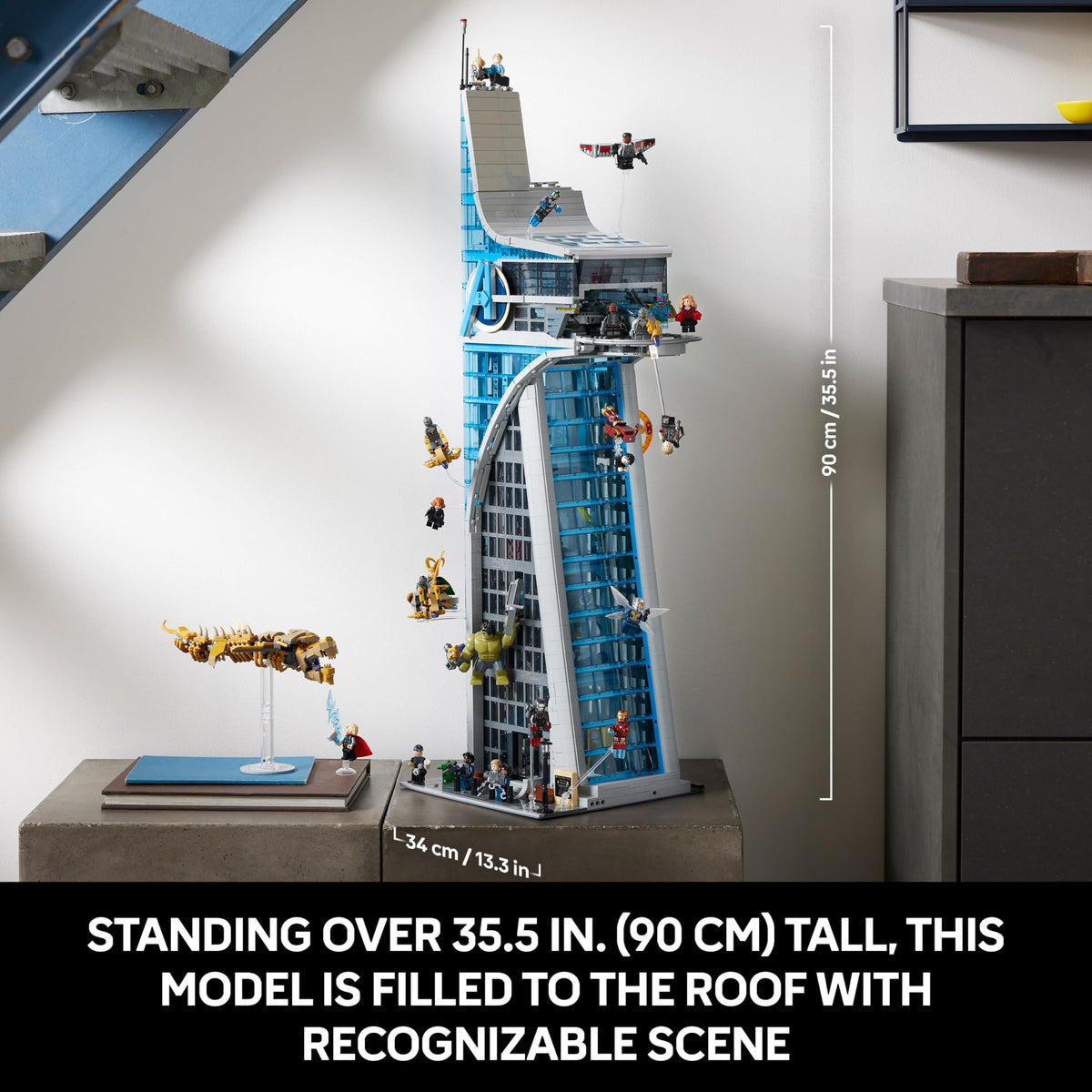 Tall blue and gray LEGO Avengers tower model with minifigures and side access