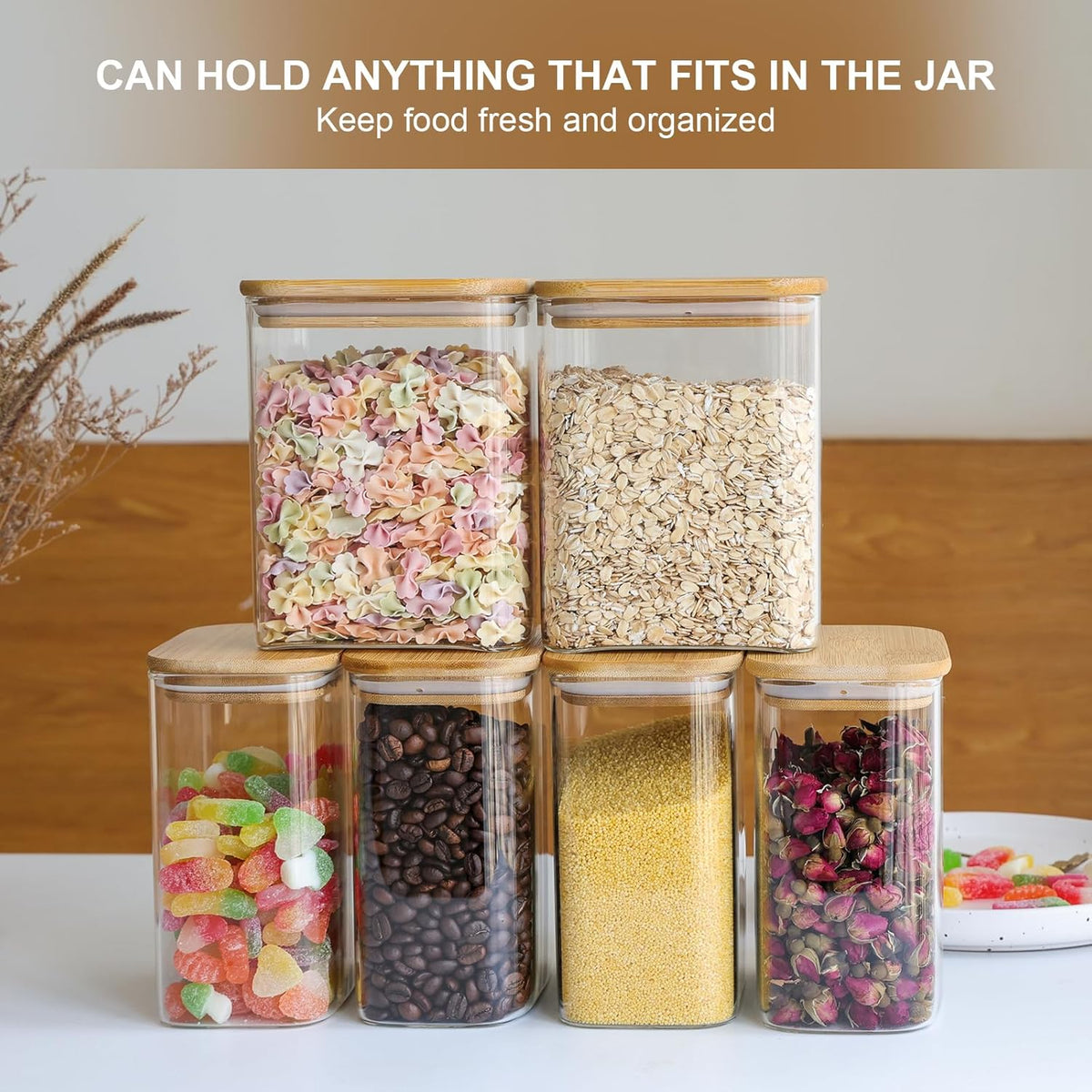 Set of six square clear glass storage jars with bamboo lids, neatly stacked for organization.