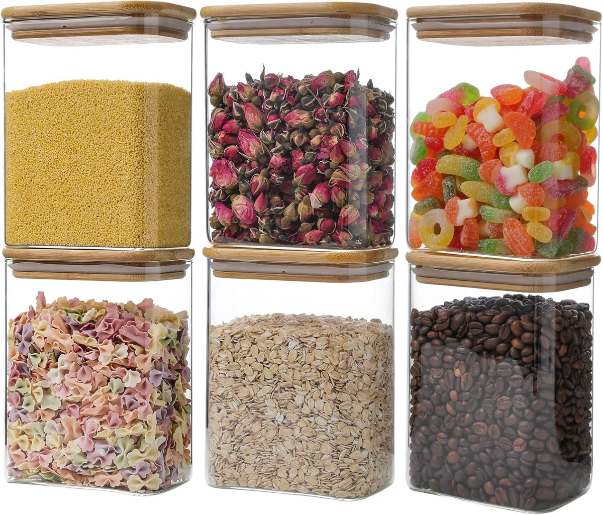 Square clear glass food storage jars with bamboo lids, shown with assorted dry contents.