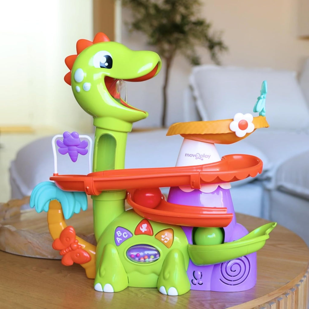 Green dinosaur ball popper on orange track with purple base and blue dinosaur figure