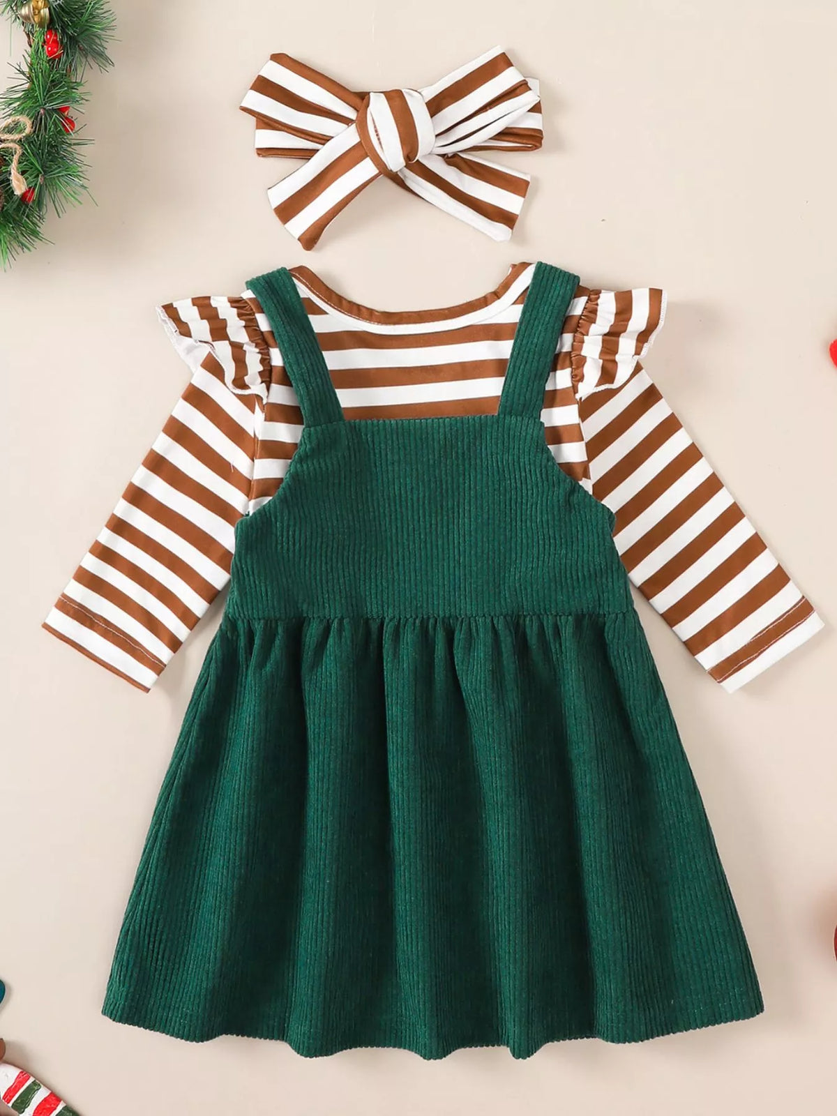 Brown-and-white striped long-sleeve bodysuit with green corduroy overall dress