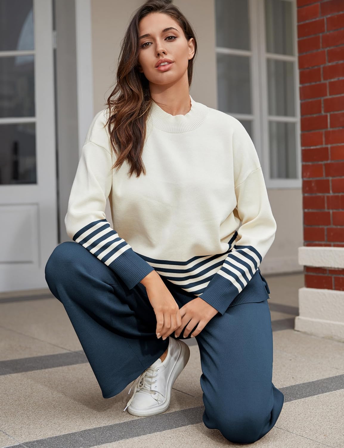 Women's lounge set: cream knit sweater with navy striped cuffs and wide-leg navy pants