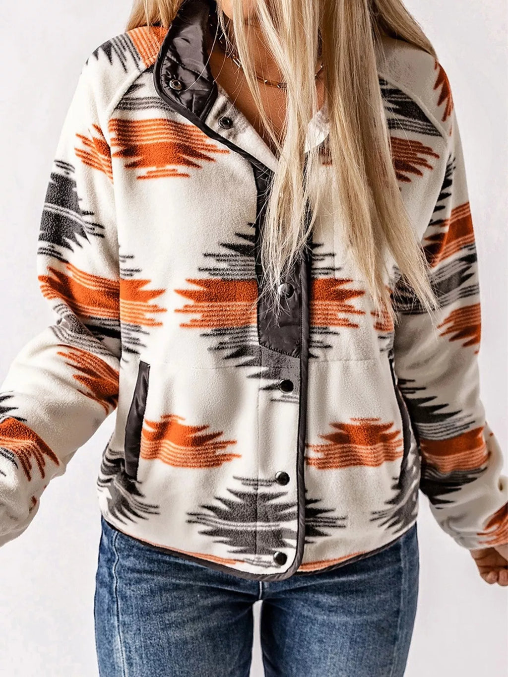 Geometric snap-down jacket front view with black snaps and orange/navy geometric print