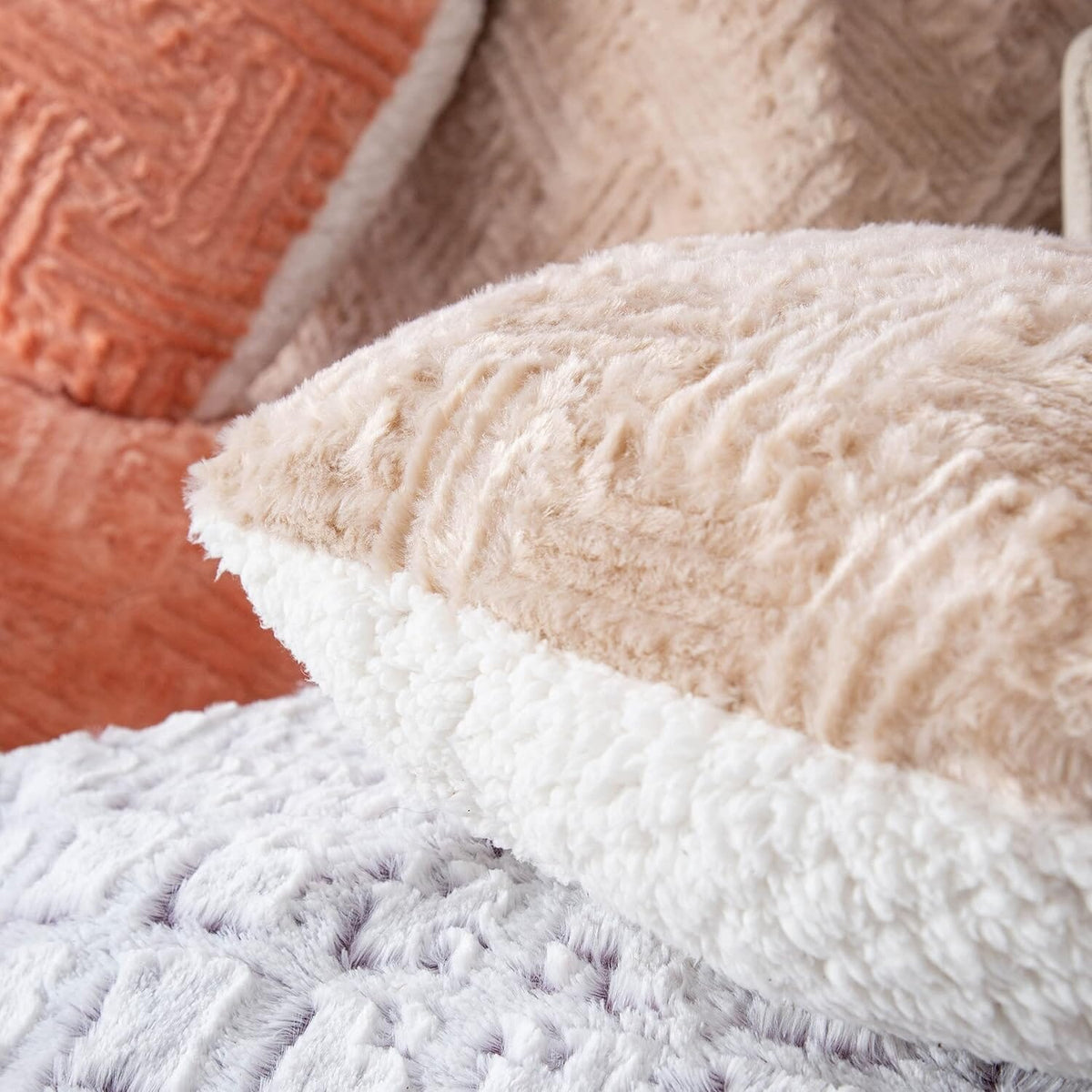Champagne beige heart throw pillow close-up, fuzzy faux-fur sherpa texture