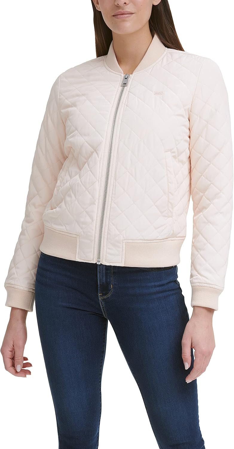 Quilted bomber jacket in pale pink with front zipper, ribbed cuffs, and stand collar