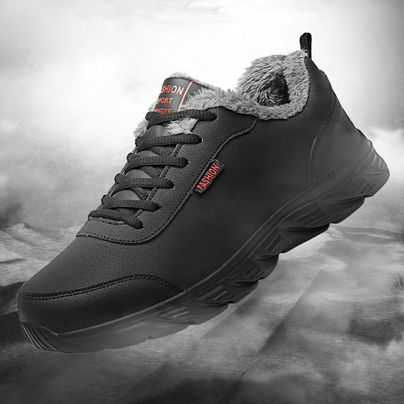 Men's black winter sneaker close-up with fuzzy collar lining and lace-up front.