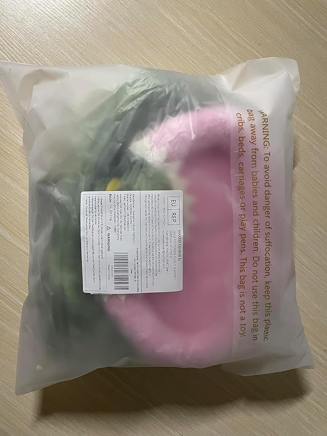 Sealed bag packaging containing green plush animal hideout tent with pink lining