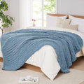 Airy blue chunky chenille knit throw blanket with thick cable-style texture