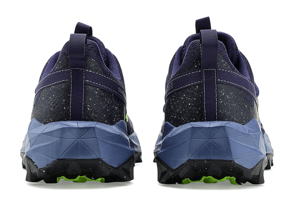 Heel view of navy trail running shoes with geometric midsole and neon green outsole accents
