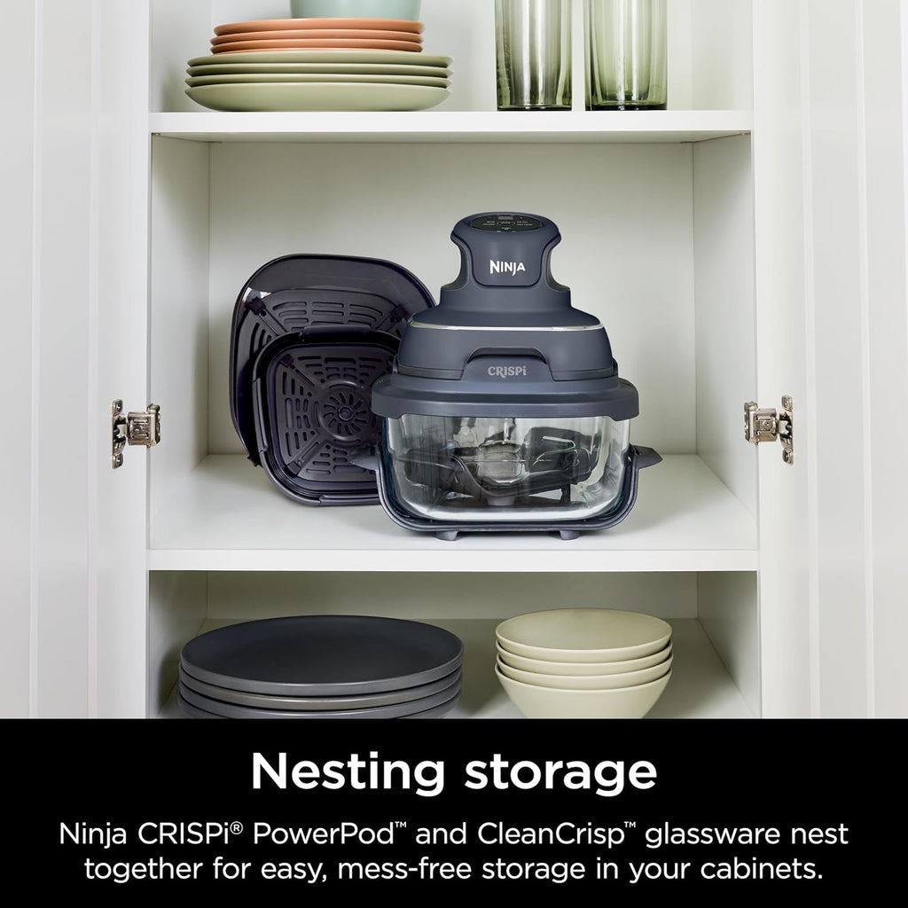 Air fryer and nested glass cookware stored in a cabinet niche