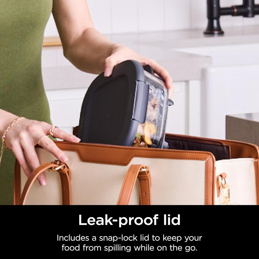 Person placing snap-lock lid onto clear glass container on a counter