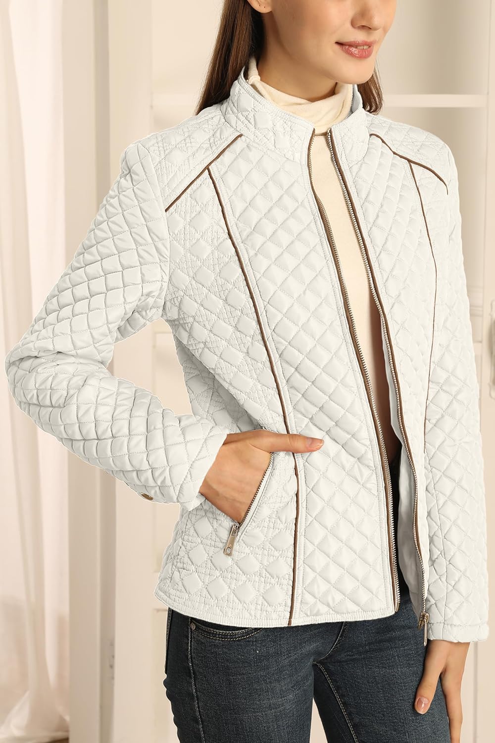 White quilted puffer coat with stand collar and full zipper, side zip pockets visible