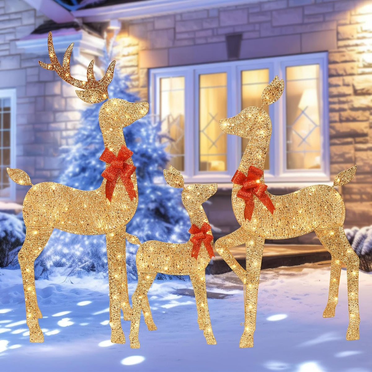 Gold glitter lighted reindeer yard decoration set with red bows, outdoors