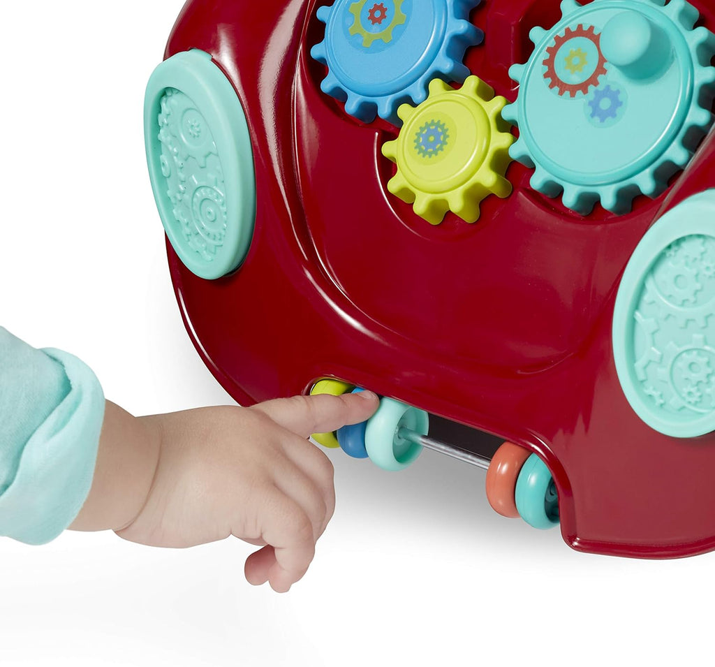 Close-up of toddler hand pulling a blue lever on red ride-on car activity panel