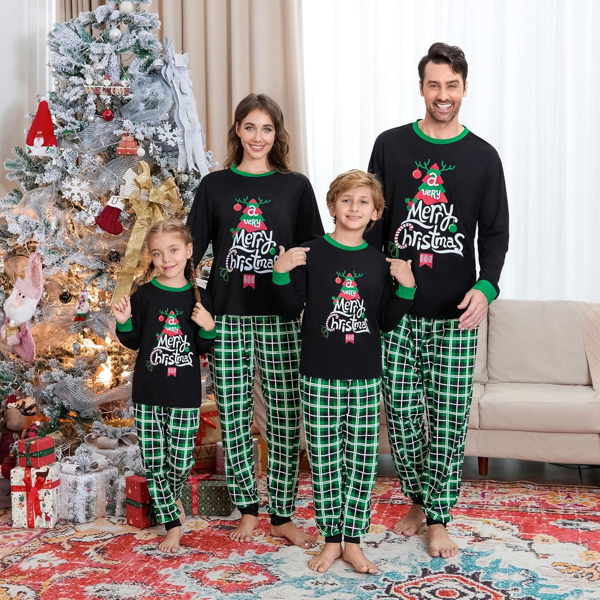 Coordinated Christmas pajama set with black tops and green plaid pajama pants for family group
