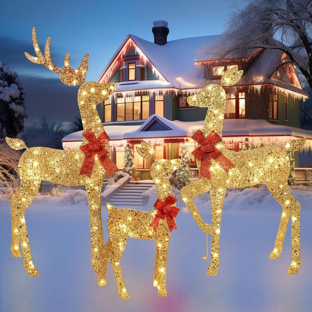 Glowing gold glitter reindeer decoration with red bows in front of house