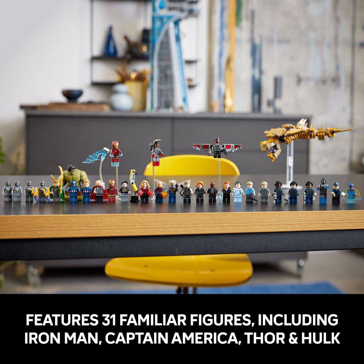 LEGO Avengers tower display with minifigures, yellow vehicle, and small accessories