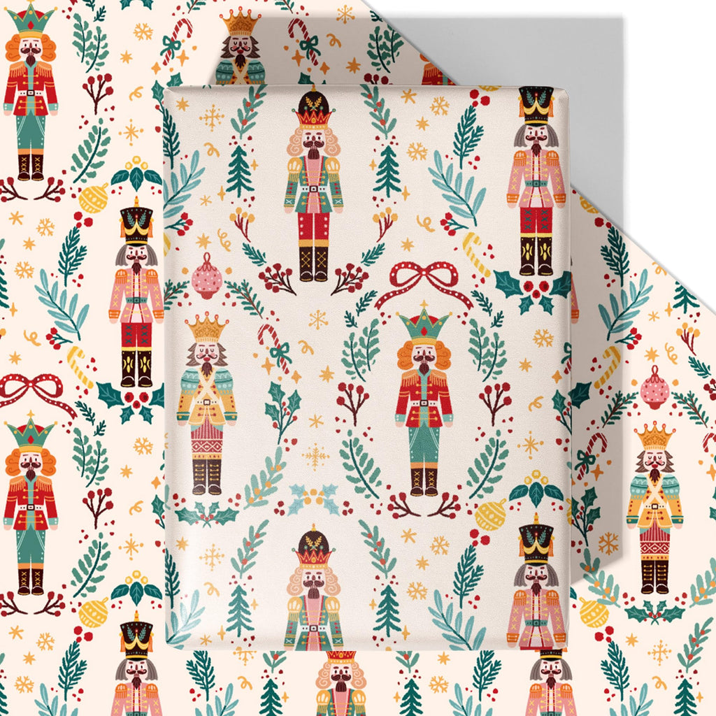 Nutcracker Christmas wrapping paper with repeating toy soldier pattern on yellow background.