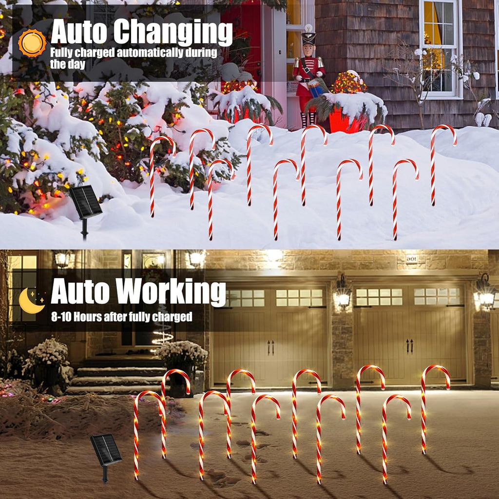 Candy cane solar pathway lights with red and white striped arches glowing at night in snow