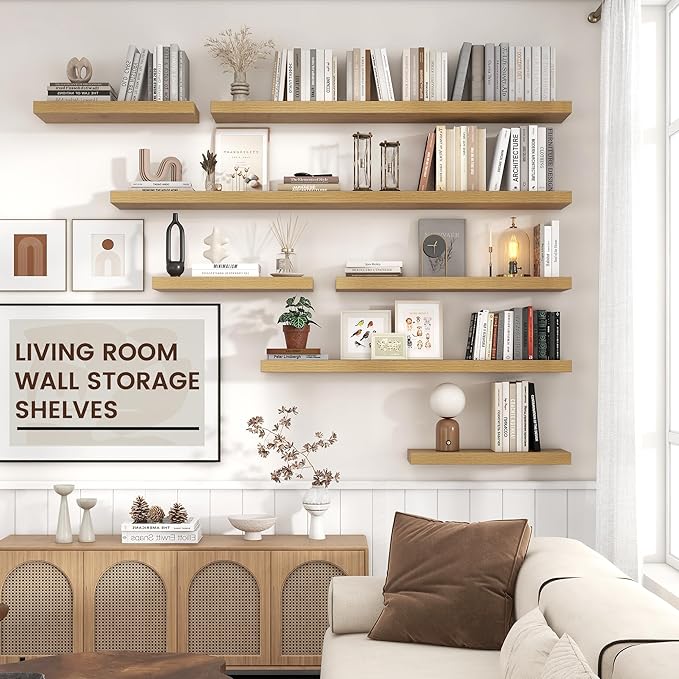Living room wall storage with multiple long oak floating shelves holding books and decor