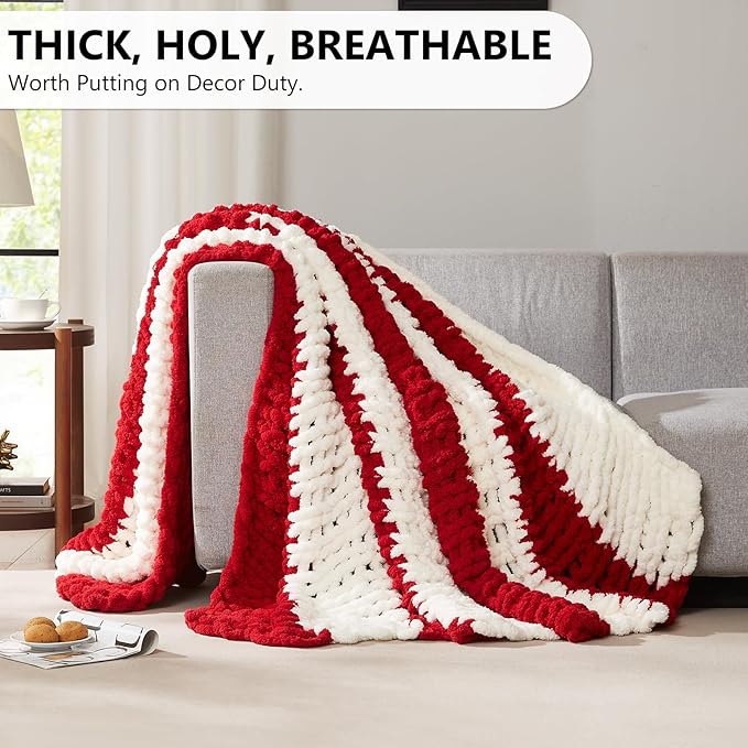 Thick chunky knit throw blanket, red and white stripe pattern over sofa