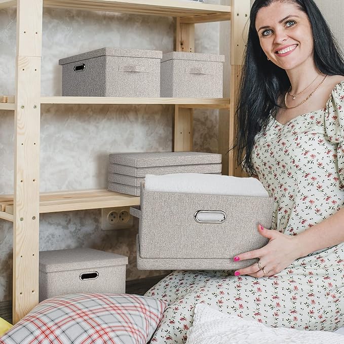 Beige fabric storage bins with lids and carry handles, placed on shelf
