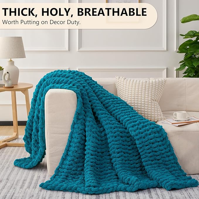 Teal chunky knit throw blanket with thick, plush looped texture, draped over seating
