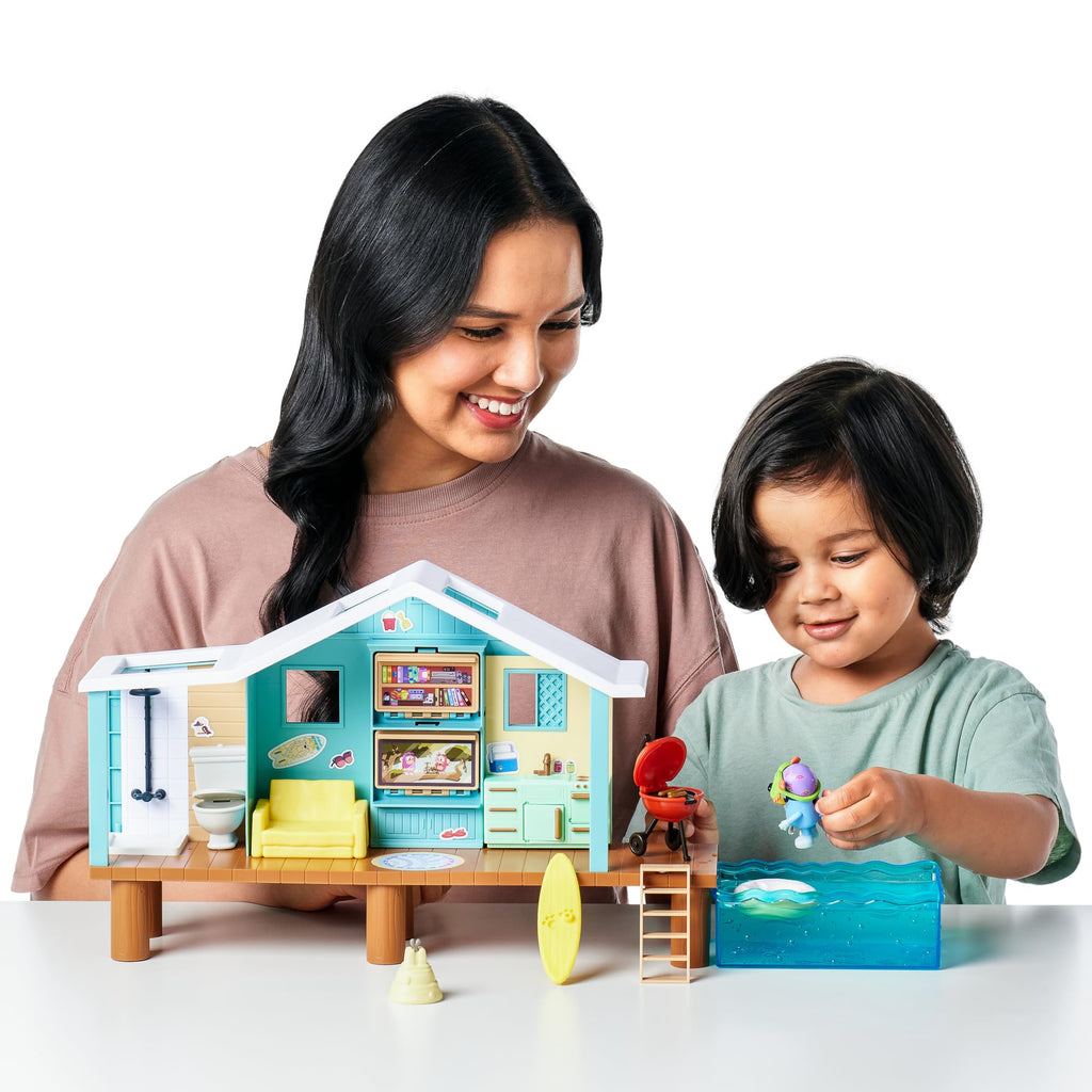 Beach cabin playset with toy house, character figure, and accessories during play