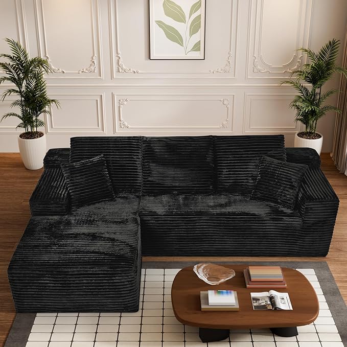 Black corduroy L-shaped sectional sofa with right chaise and tufted back cushions