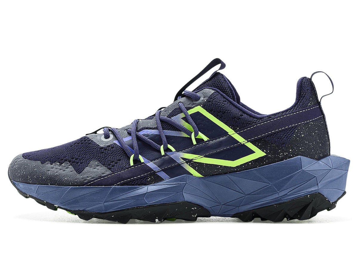 Navy trail running shoe with neon green stripe detail, supportive geometric midsole