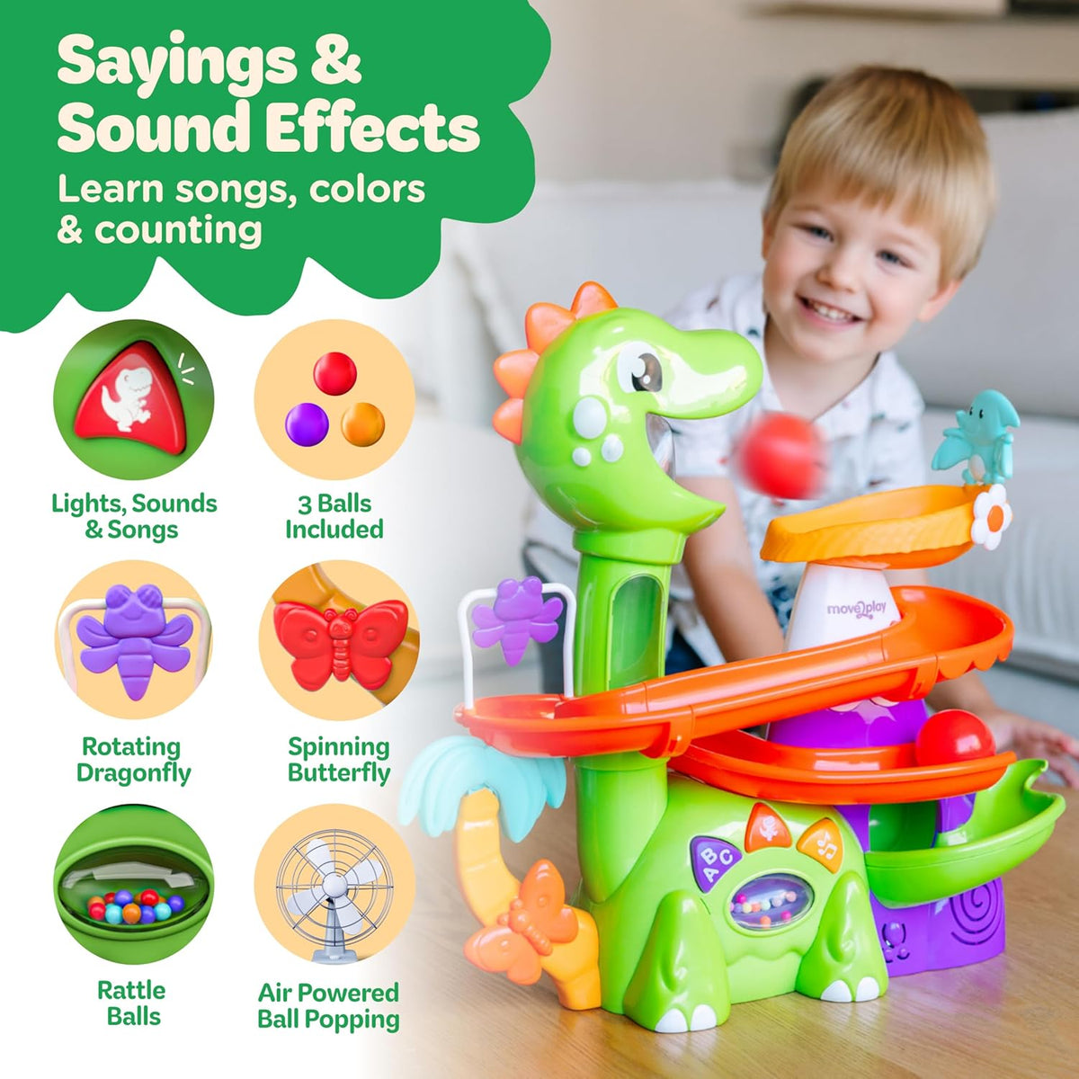 Multicolor dinosaur ball popper with rotating parts, glowing panel, and orange track