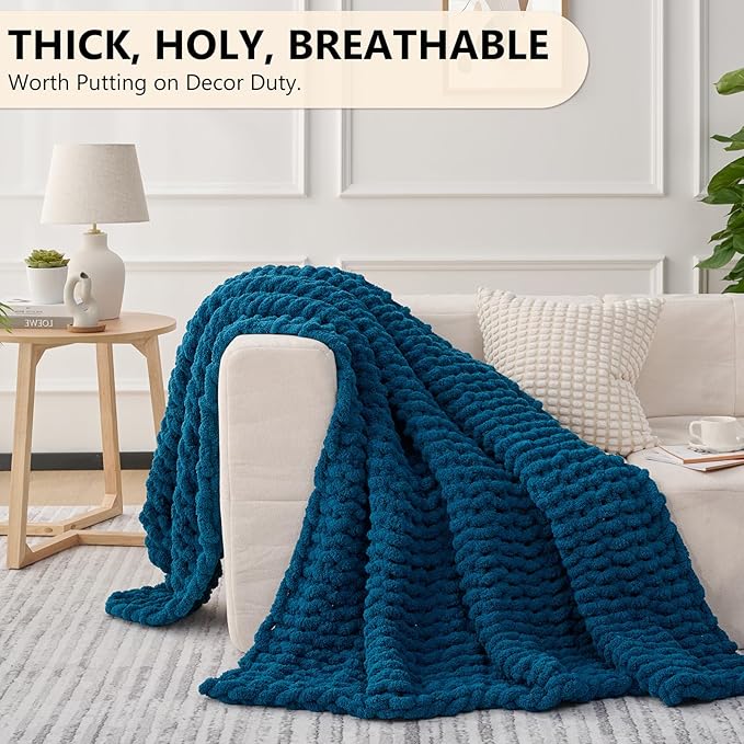 Chunky chenille throw blanket, bright blue, draped across couch
