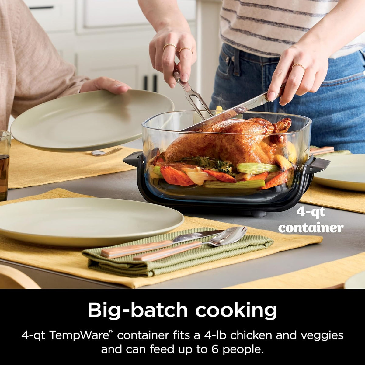4-qt clear glass air fryer container on base with lid removed and roasted food