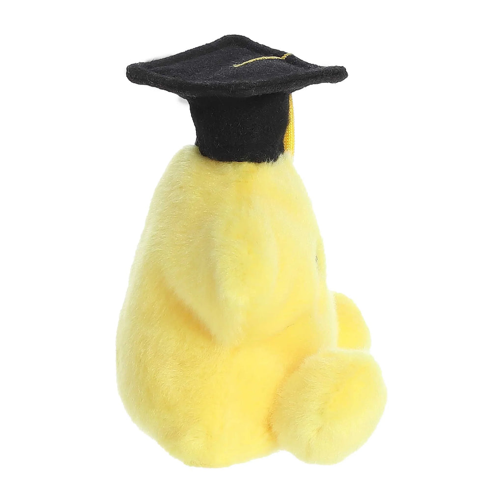 Yellow plush star graduation topper side view with black cap and gold tassel
