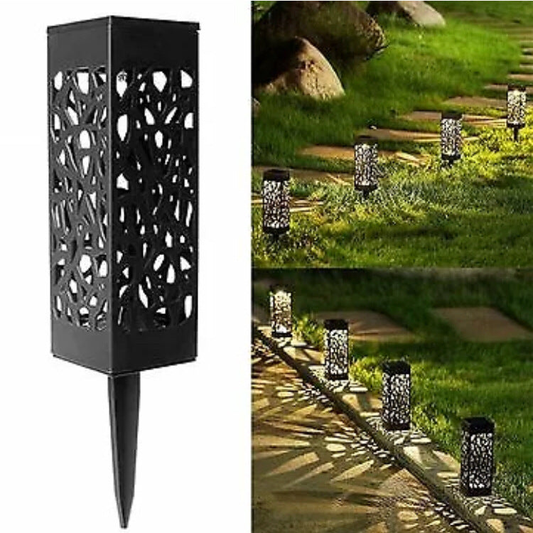 Black solar garden lantern light with geometric cutouts and pointed ground stake