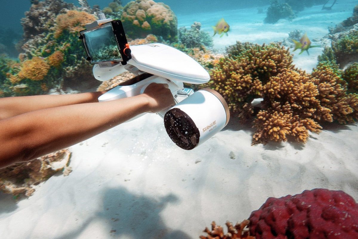 White underwater drone with phone mount and dual black fan grills