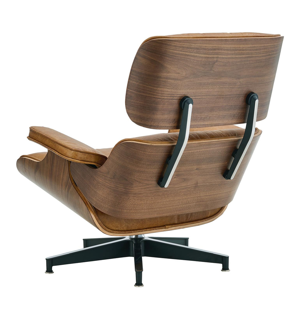 Brown leather swivel chair with ottoman-style footrest and black pedestal base